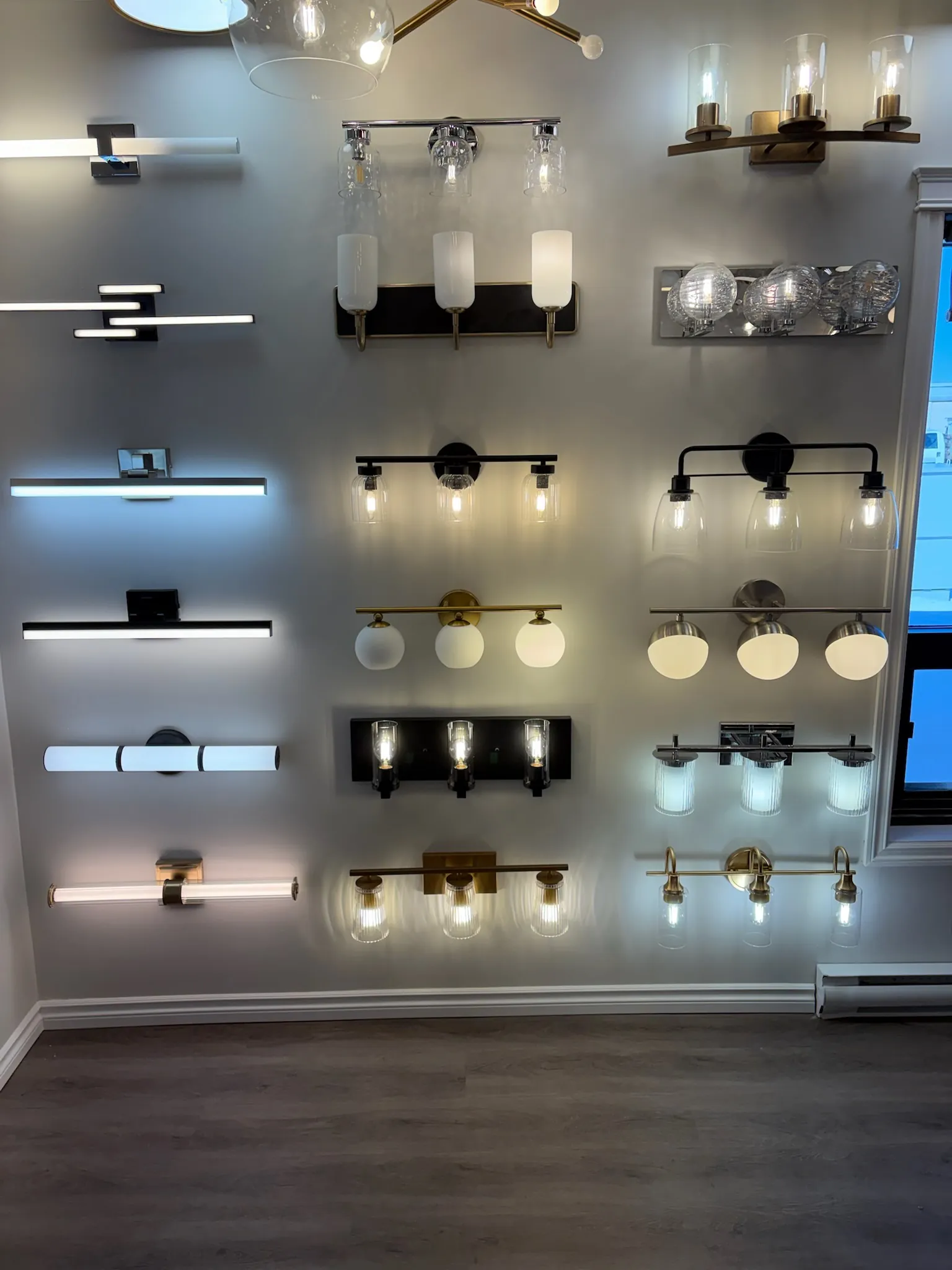The Ensuite lighting showroom ceiling with multiple hanging fixtures
